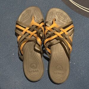 CROCS Women black gold flip flops Sandals